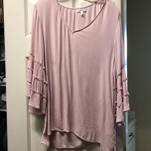 light pink ruffles on the sleeves